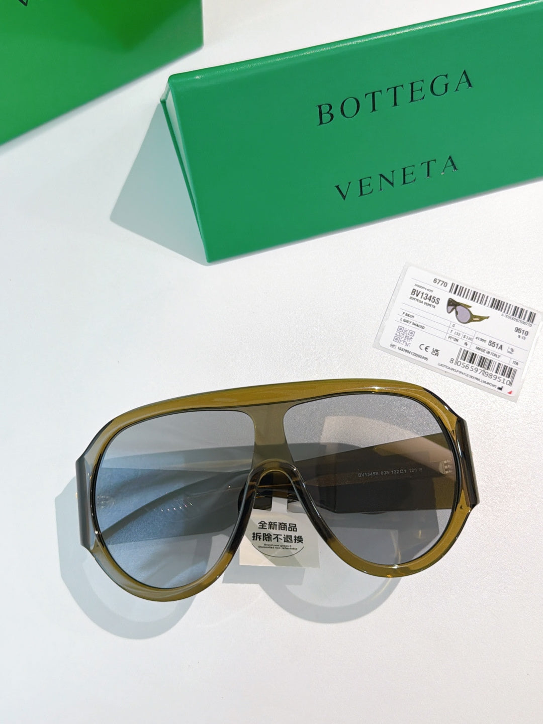 Bottega Veneta aviator sunglasses with olive-gold frames and dark lenses