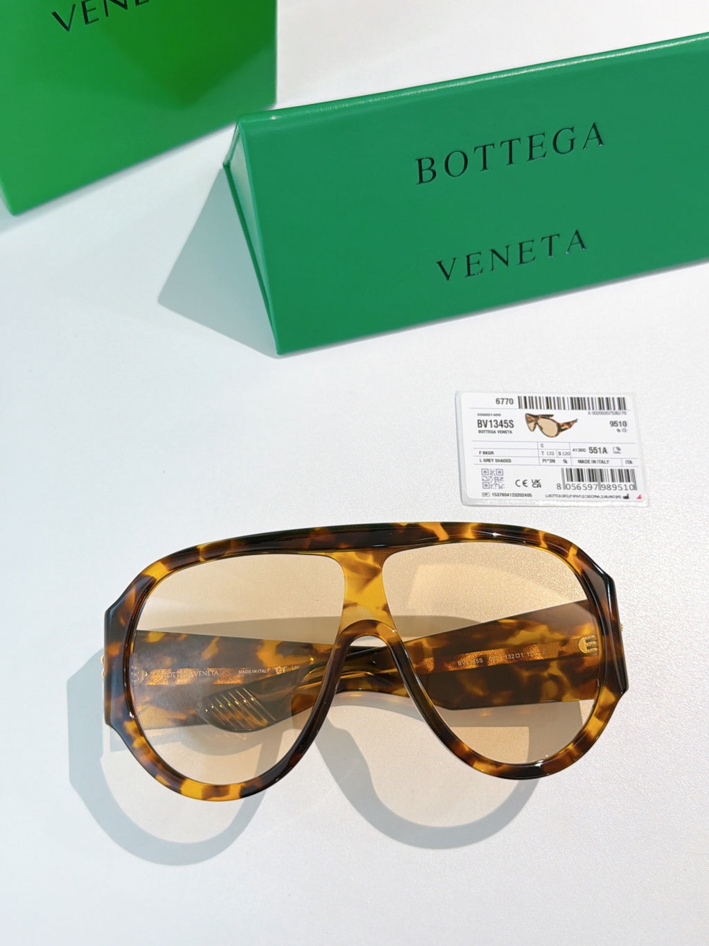 Bottega Veneta aviator sunglasses with tortoise frames and amber lenses