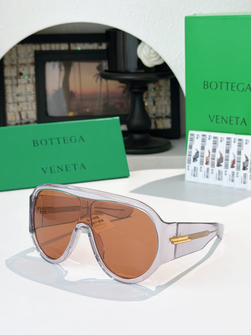 Bottega Veneta sunglasses with amber lenses and tortoiseshell frames, gold detail