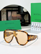 Bottega Veneta sunglasses with warm tan lenses and dark tortoiseshell frames