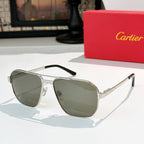 Cartier sunglasses with silver frame and muted green lenses, aviator style.