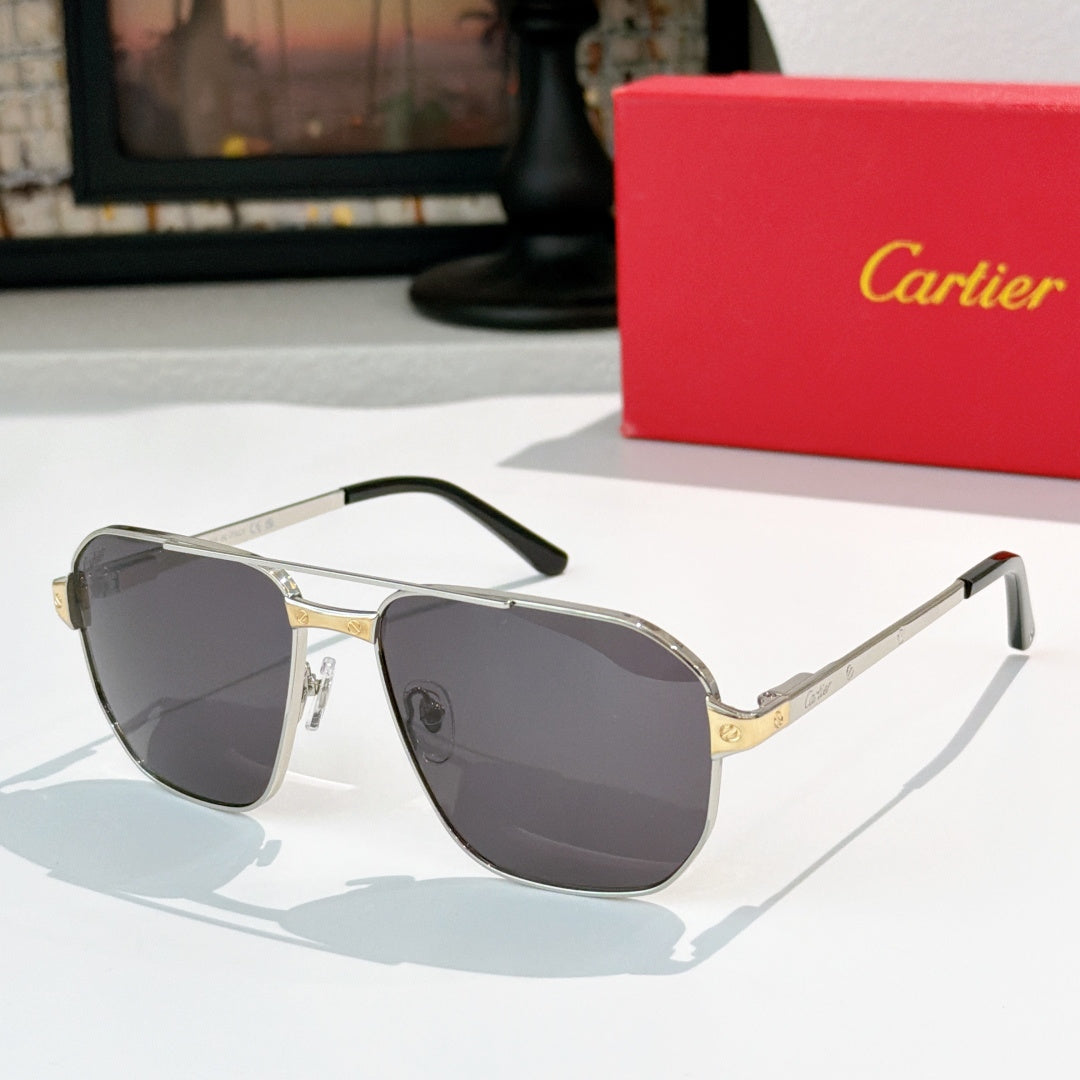 Cartier sunglasses with gold frame and dark gray lenses, aviator style.