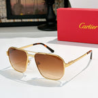 Cartier sunglasses with gold frame and amber-brown lenses, aviator style.