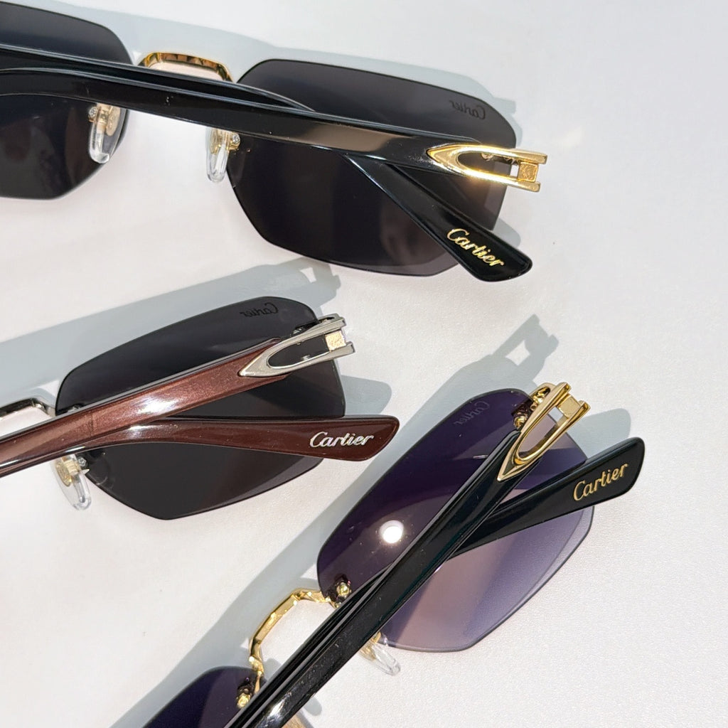 Cartier sunglasses close-up set: black frames with gold details and tinted lenses