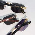 Cartier sunglasses close-up set: black frames with gold details and tinted lenses
