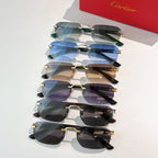 Stack of Cartier sunglasses with tinted lenses and mixed silver and gold frames