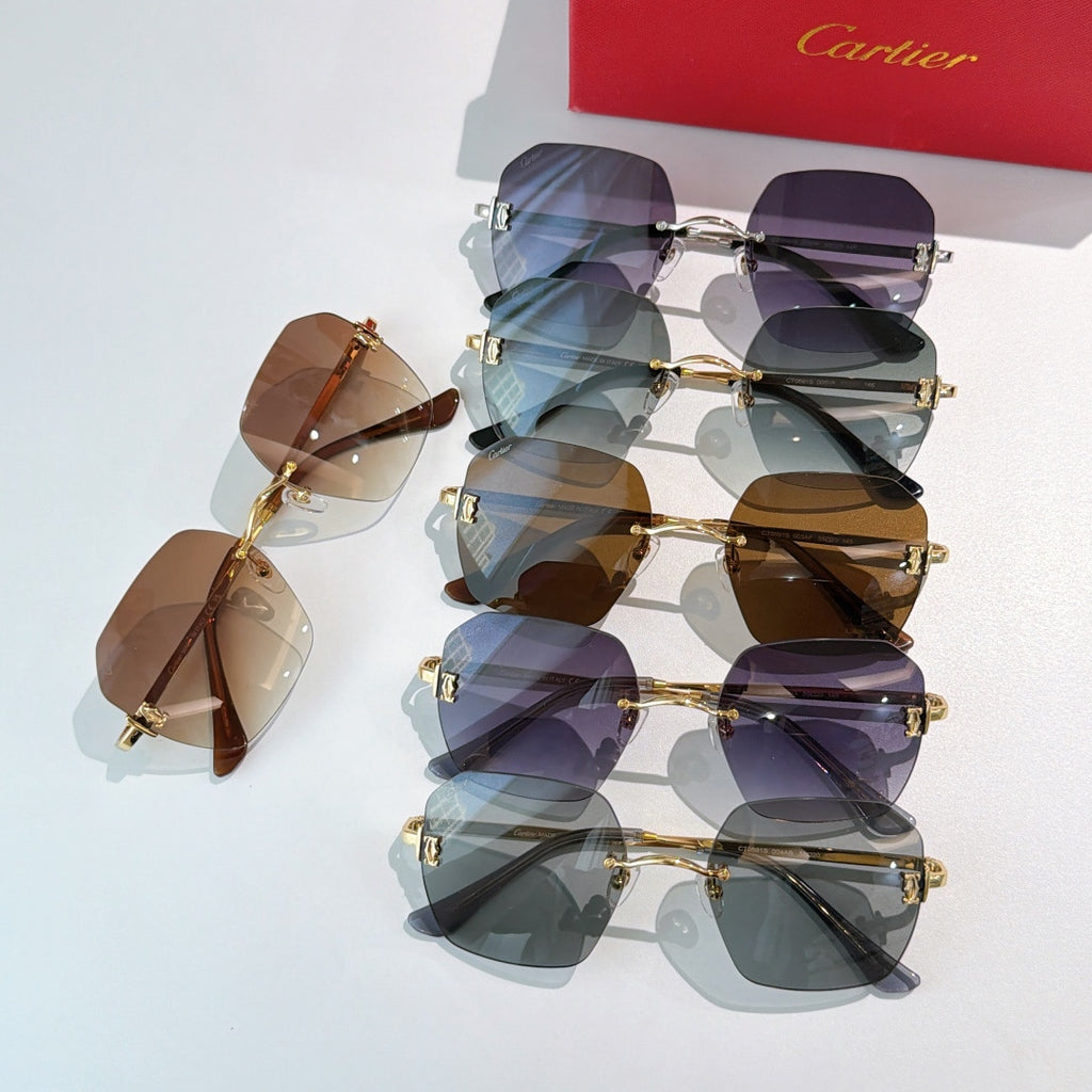 Assorted Cartier sunglasses with mixed tinted lenses and gold frames, stacked together