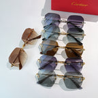 Assorted Cartier sunglasses with mixed tinted lenses and gold frames, stacked together