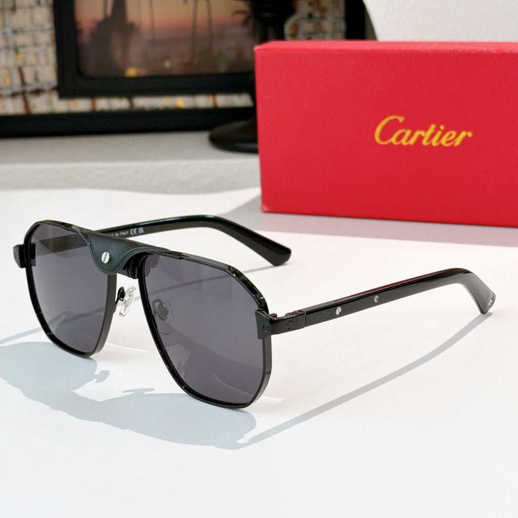 Cartier sunglasses with dark frames, gold bridge, and dark gray lenses.