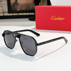 Cartier sunglasses with dark frames, gold bridge, and dark gray lenses.