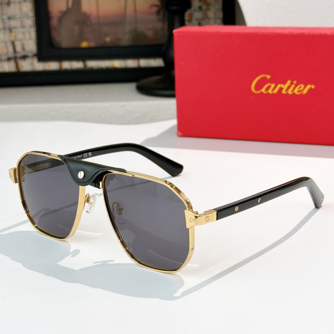 Cartier sunglasses with tortoiseshell arms, gold accents, and dark blue lenses.