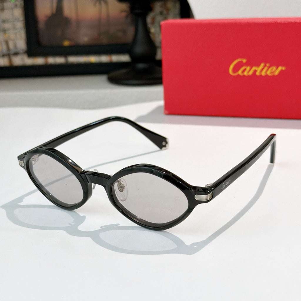 Cartier glasses with black round frames and clear-to-light tinted lenses