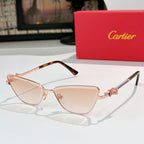 Rose gold-tone cat-eye eyeglasses with light pink tinted lenses and patterned temples