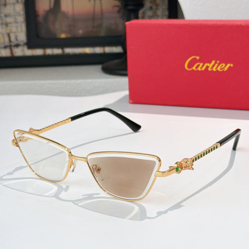 Gold-tone cat-eye eyeglasses with light brown tinted lenses and dark temple tips