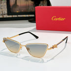 Gold-tone cat-eye eyeglasses with light gray tinted lenses and black temple tips