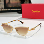 Gold-tone cat-eye eyeglasses with amber tinted lenses and tortoiseshell temple accents
