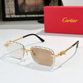 Cartier sunglasses with gold frame and light tan tinted lenses, black temples.
