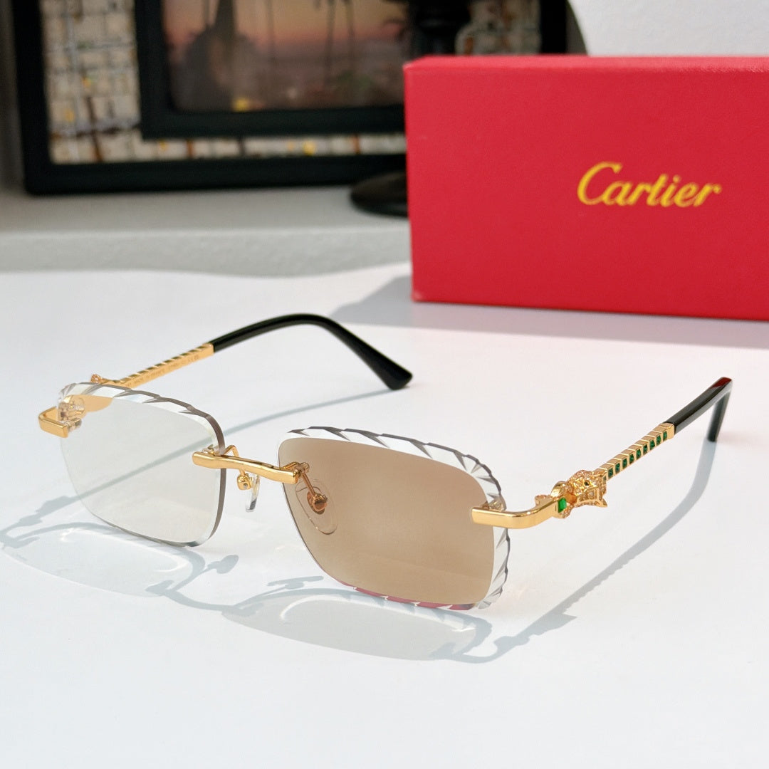 Cartier sunglasses with gold frame and light tan tinted lenses, black temples.