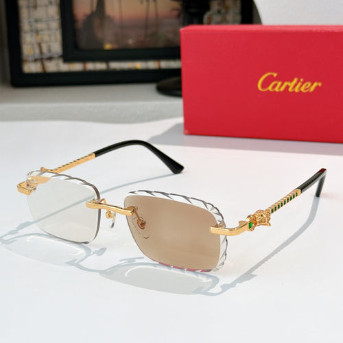 Cartier sunglasses with gold frame and light tan tinted lenses, black temples.