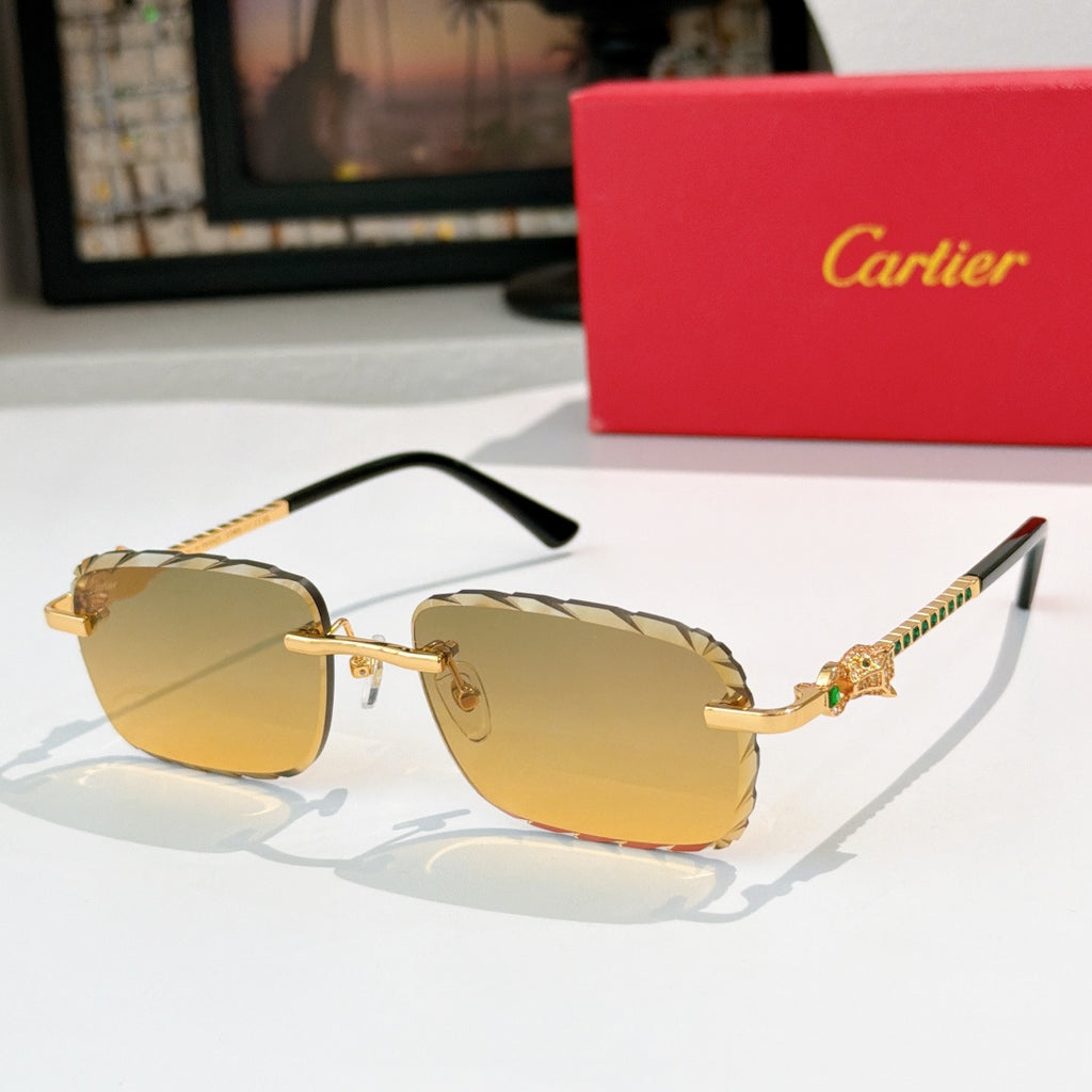 Cartier sunglasses with gold frame and amber tinted lenses, black temples.