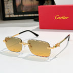 Cartier sunglasses with gold frame and amber tinted lenses, black temples.