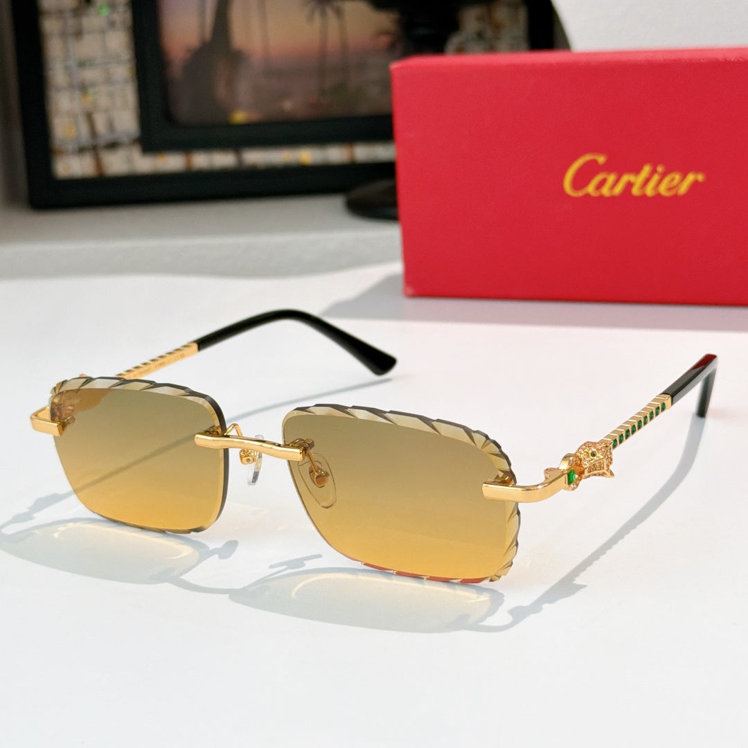 Cartier sunglasses with gold frame and amber tinted lenses, black temples.