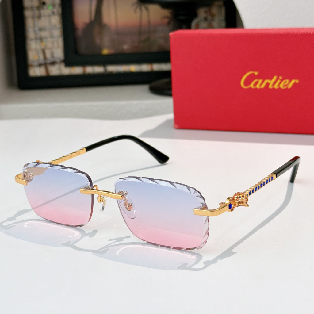 Cartier sunglasses with gold frame and light blue tinted lenses, black temples.