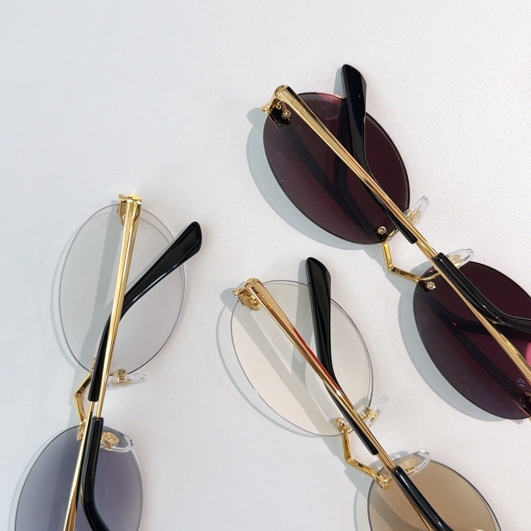 Cartier glasses with gold metal frame, dark maroon lenses, and black temple tips