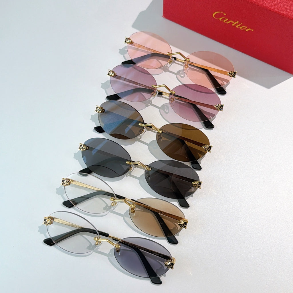Cartier glasses with round gold frames and assorted tinted lenses in a set