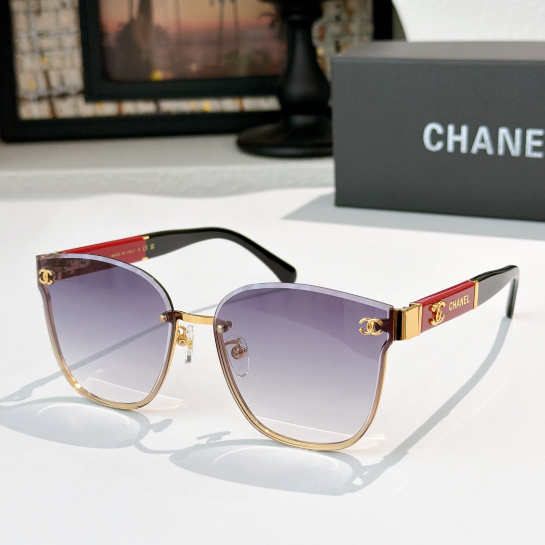 Chanel cat-eye sunglasses with purple tinted lenses, gold-tone frame and black temples