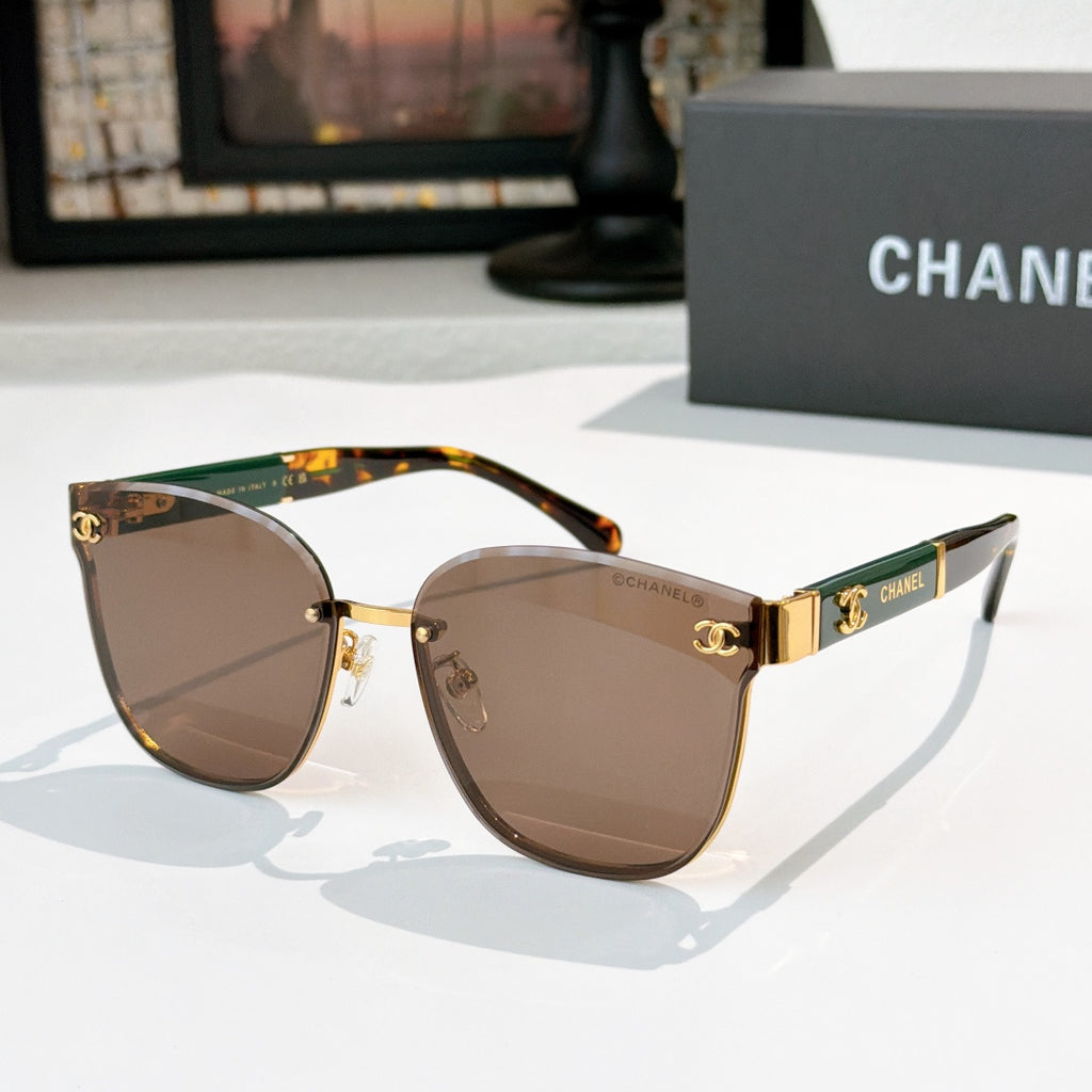 Chanel cat-eye sunglasses with brown lenses, gold-tone frame and tortoiseshell temples