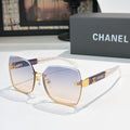 Square cat-eye sunglasses with blue gradient lenses and gold-tone metal frame