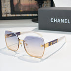 Square cat-eye sunglasses with blue gradient lenses and gold-tone metal frame
