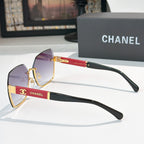 Cat-eye sunglasses with violet lenses, black temples, and gold-tone details