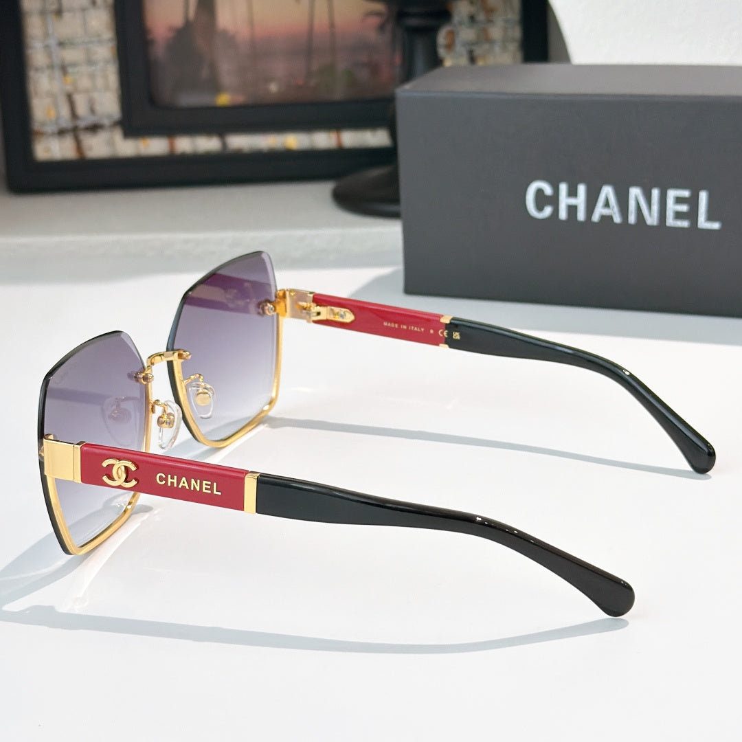 Cat-eye sunglasses with violet lenses, black temples, and gold-tone details