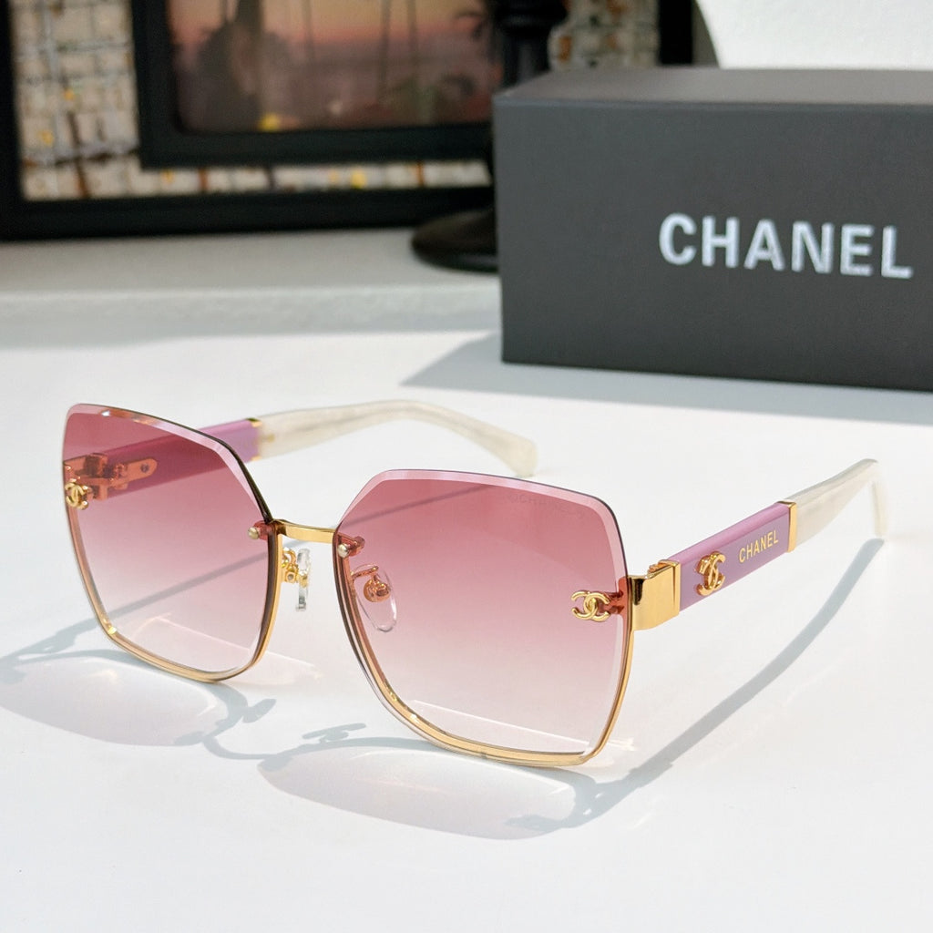 Cat-eye sunglasses with pink gradient lenses and gold-tone frame