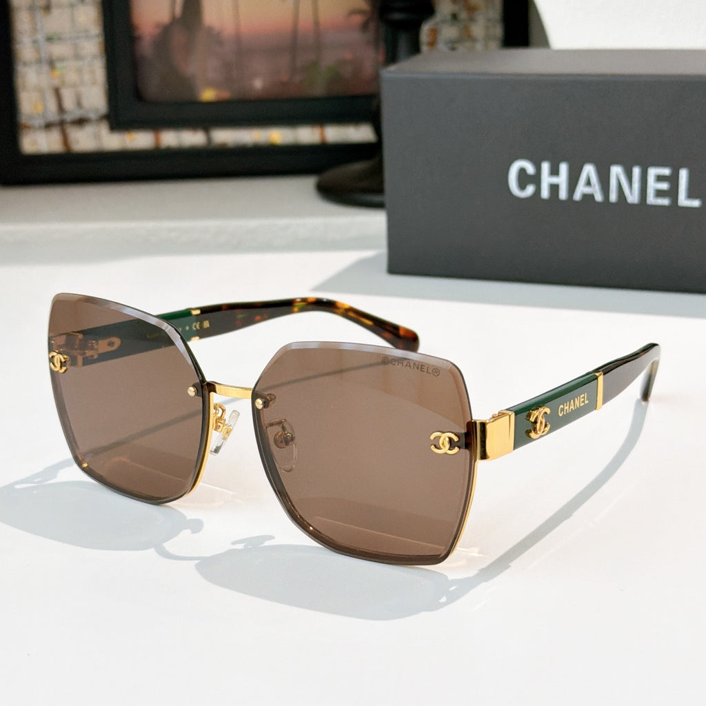 Square cat-eye sunglasses with brown gradient lenses, tortoiseshell temples, gold accents