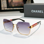 Cat-eye sunglasses with purple gradient lenses, gold-tone frame, dark temples