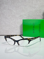 Bottega Veneta glasses with tortoiseshell front, dark temples, and clear lenses