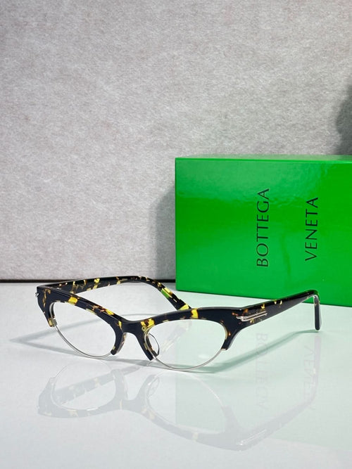 Bottega Veneta glasses with dark tortoiseshell frames and clear lenses