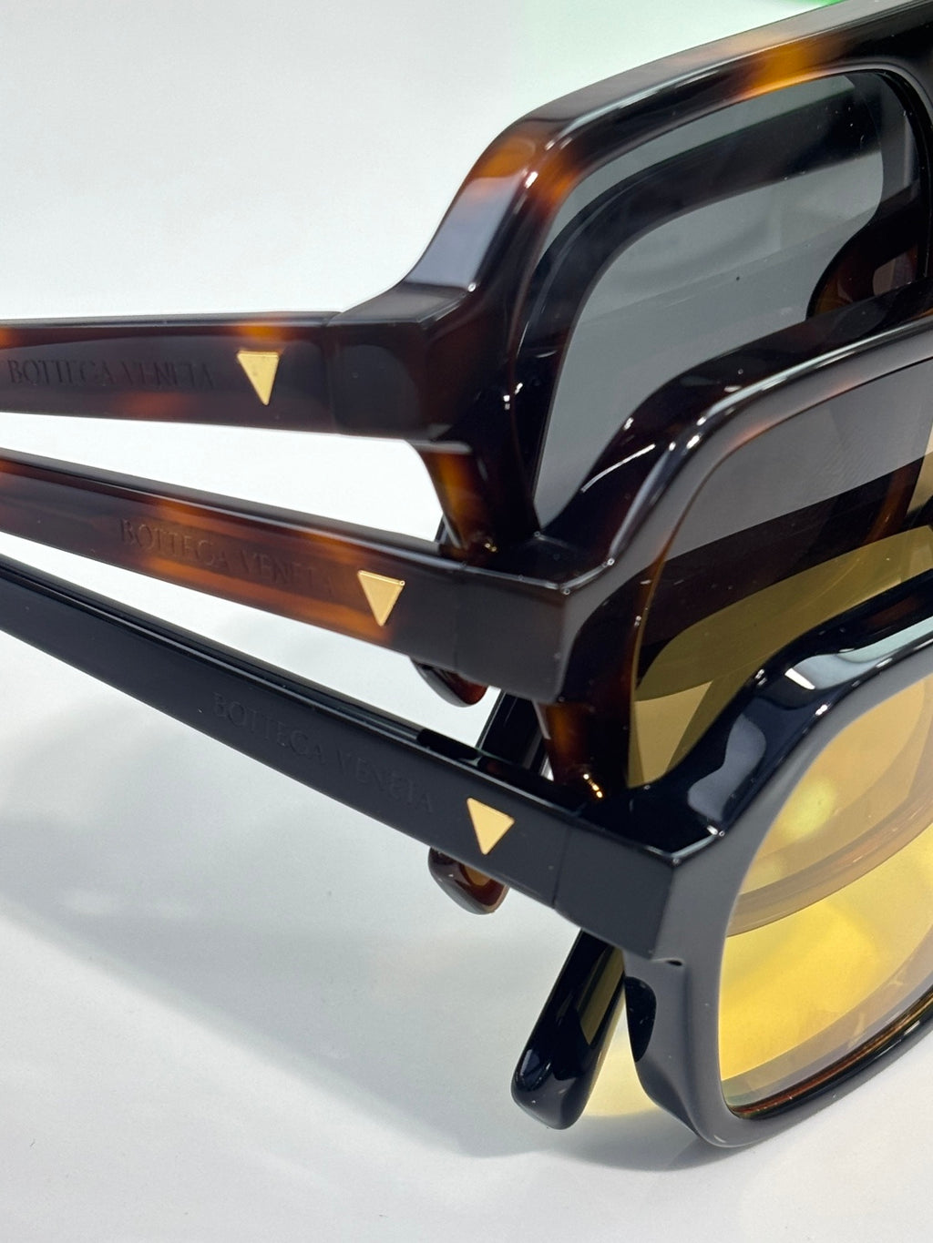 Tortoiseshell and black eyeglass frames with clear lenses