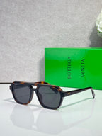 Bottega Veneta sunglasses with dark lenses and black-and-tortoise frames