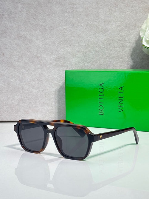 Bottega Veneta sunglasses with dark lenses and black-and-tortoise frames