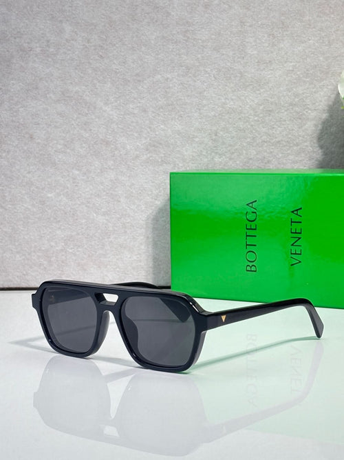 Sunglasses with dark lenses and black frame, tortoise temple tip, side view