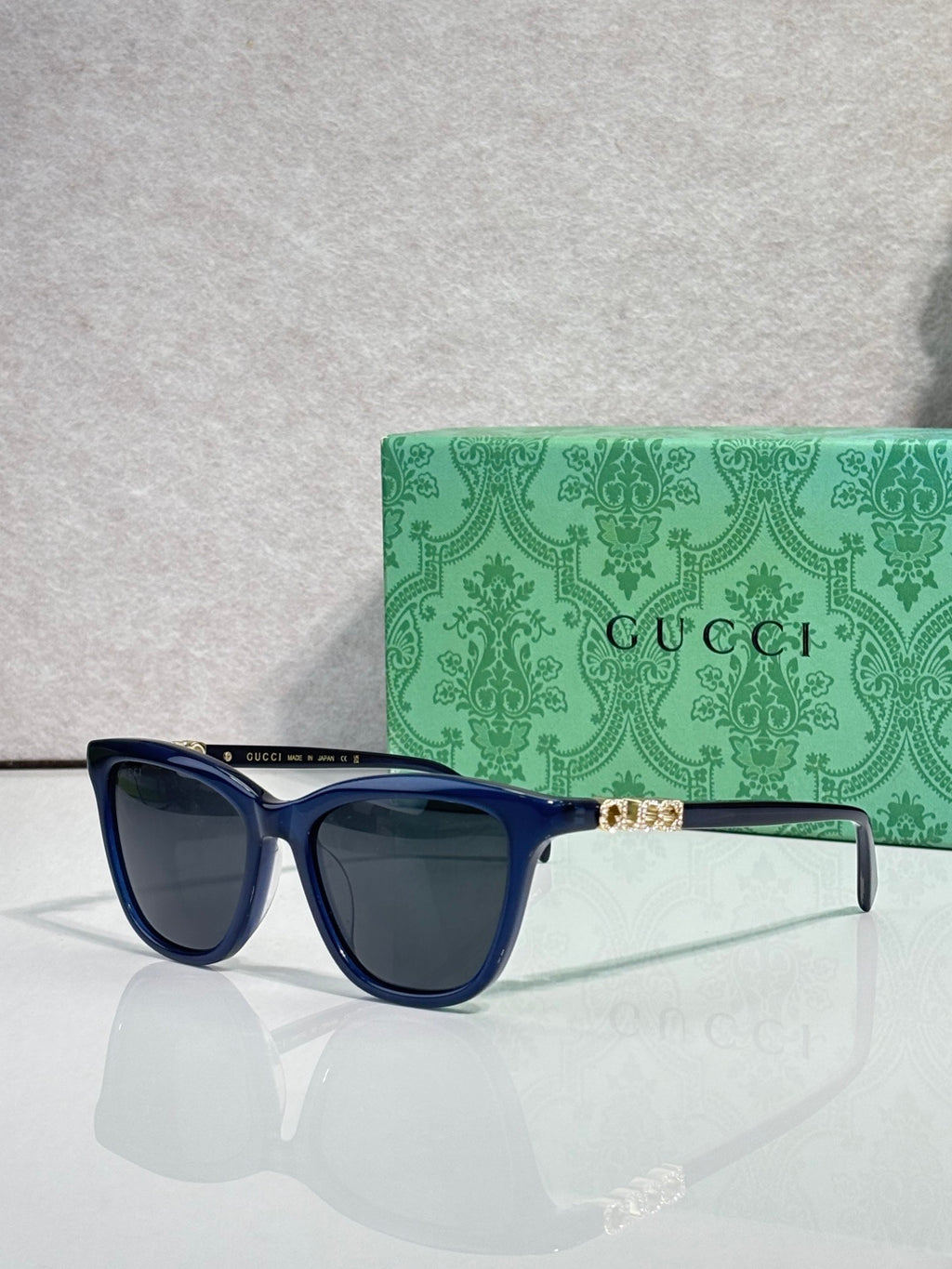 Gucci cat-eye sunglasses with blue acetate frames and dark lenses