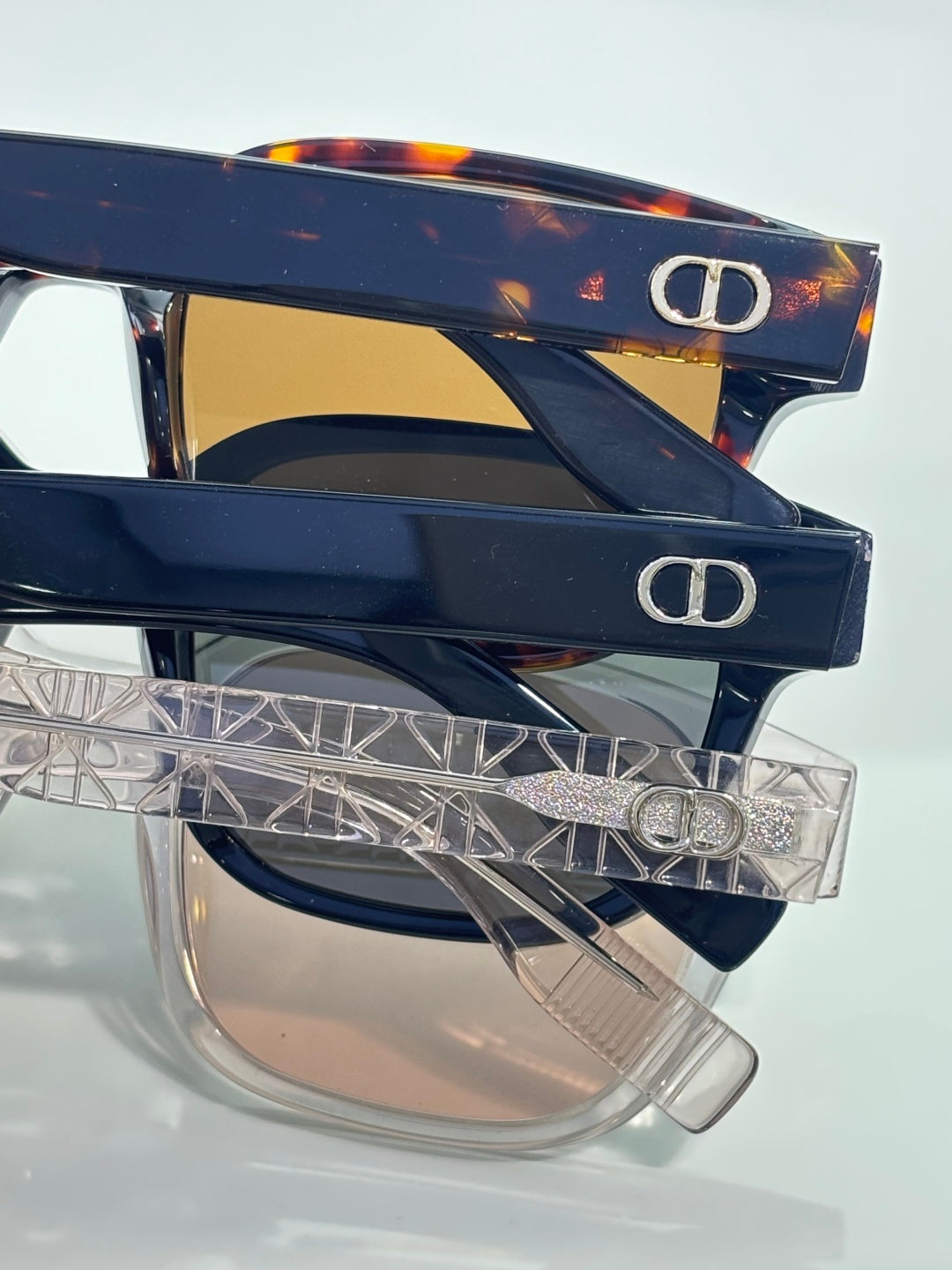 Navy sunglasses with tinted lenses and clear temple design