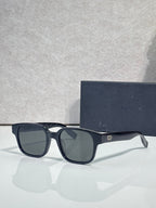 Black sunglasses with dark lenses and slim logo temple detail