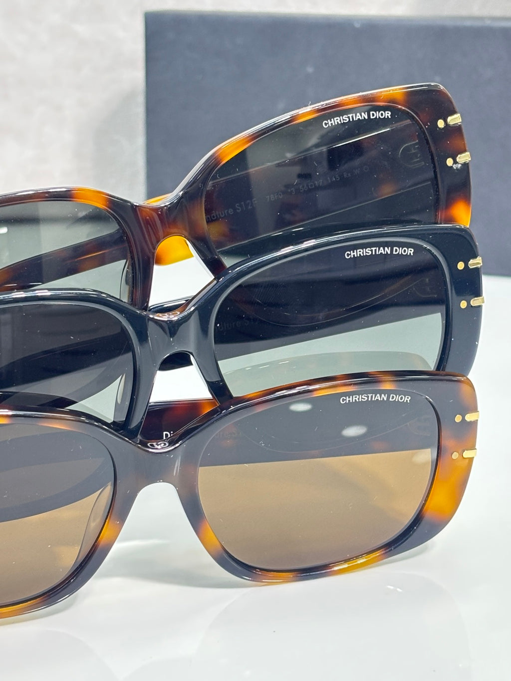 Oversized Dior sunglasses with stacked logo temples and dark lenses