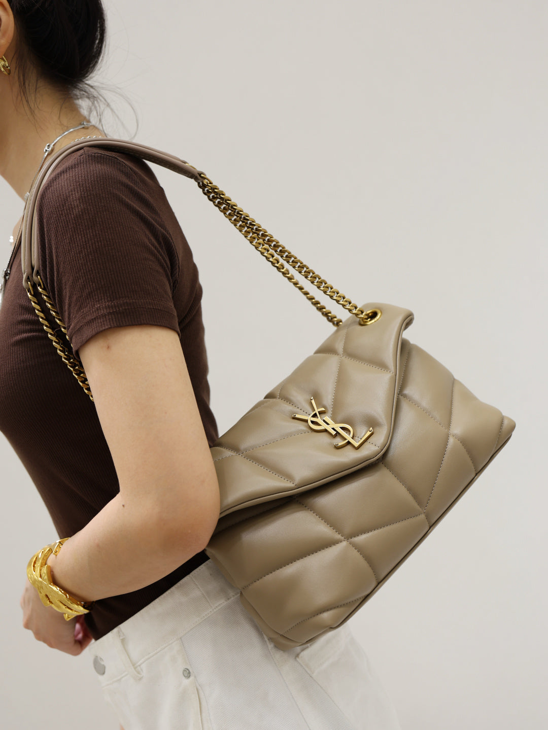 YSL quilted shoulder bag with gold YSL logo and chain strap, beige