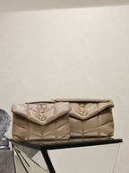 YSL quilted shoulder bag with flap, gold YSL logo, top handle and chain, beige
